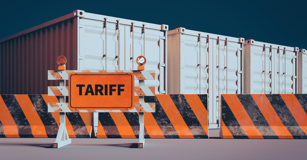 Three shipping containers and a sign that says tariffs