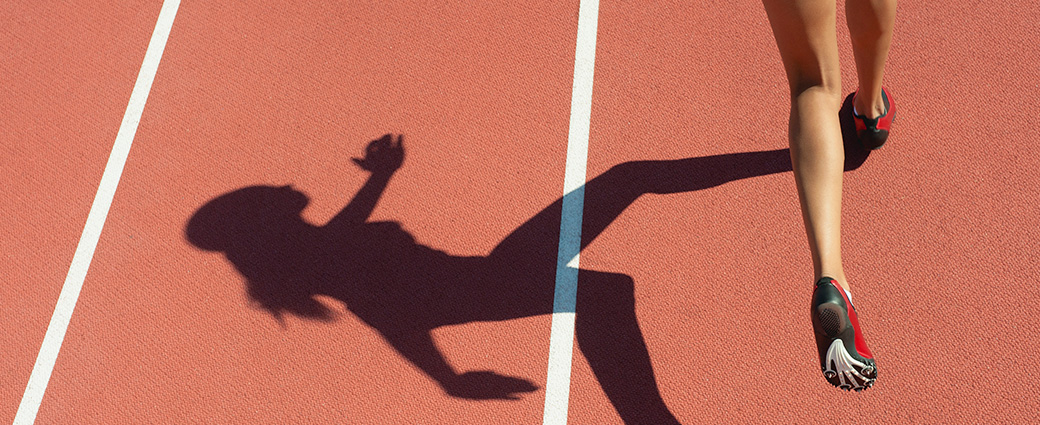 A shadow of a woman running.