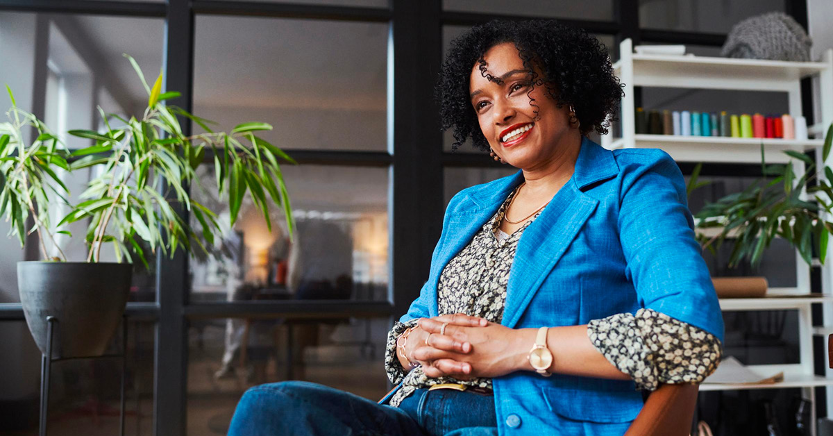 Woman sitting in chair smiling