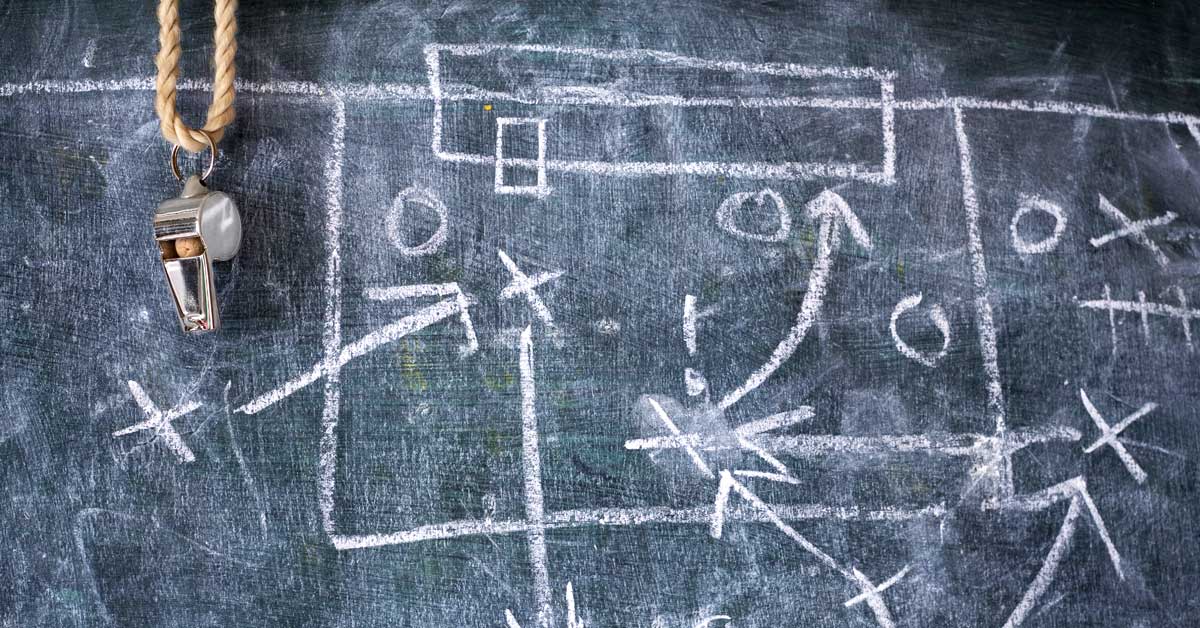 A chalkboard with football plays.